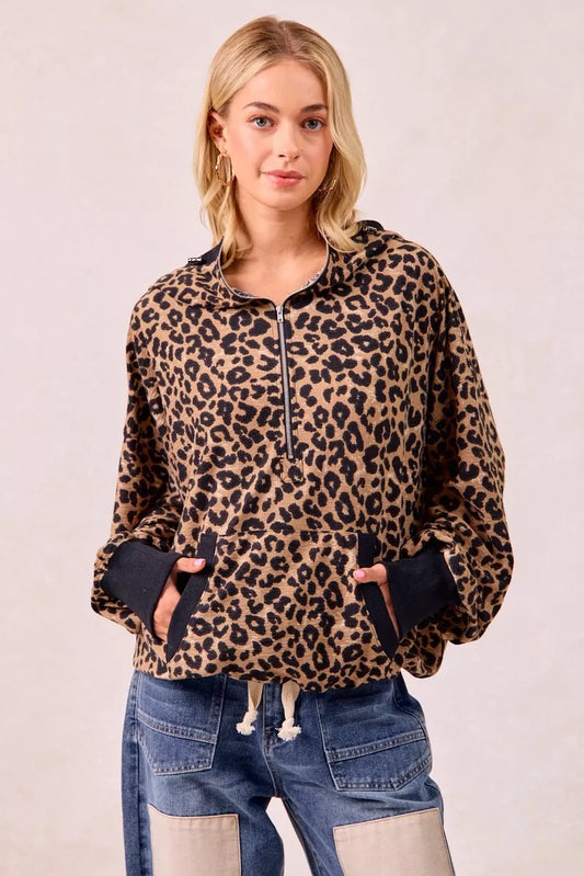 Leopard print waffle knit half zip pullover hoodie styled with jeans for casual boho-luxe everyday look.