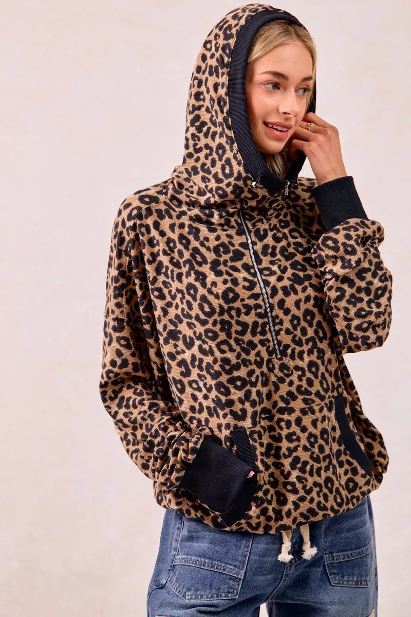 Leopard print waffle half zip pullover hoodie with hood up for cozy fall animal print outfit inspo.