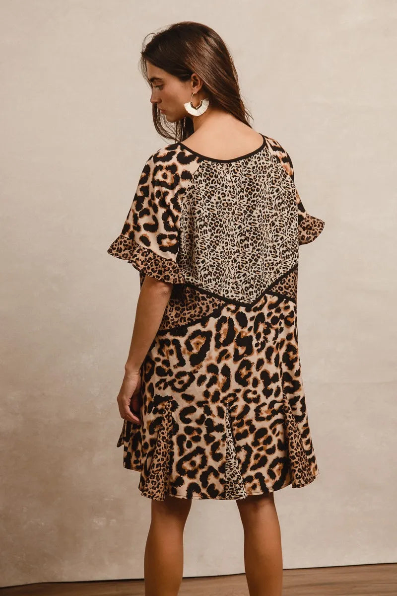 Back view of leopard print mini dress with relaxed fit and ruffle sleeves