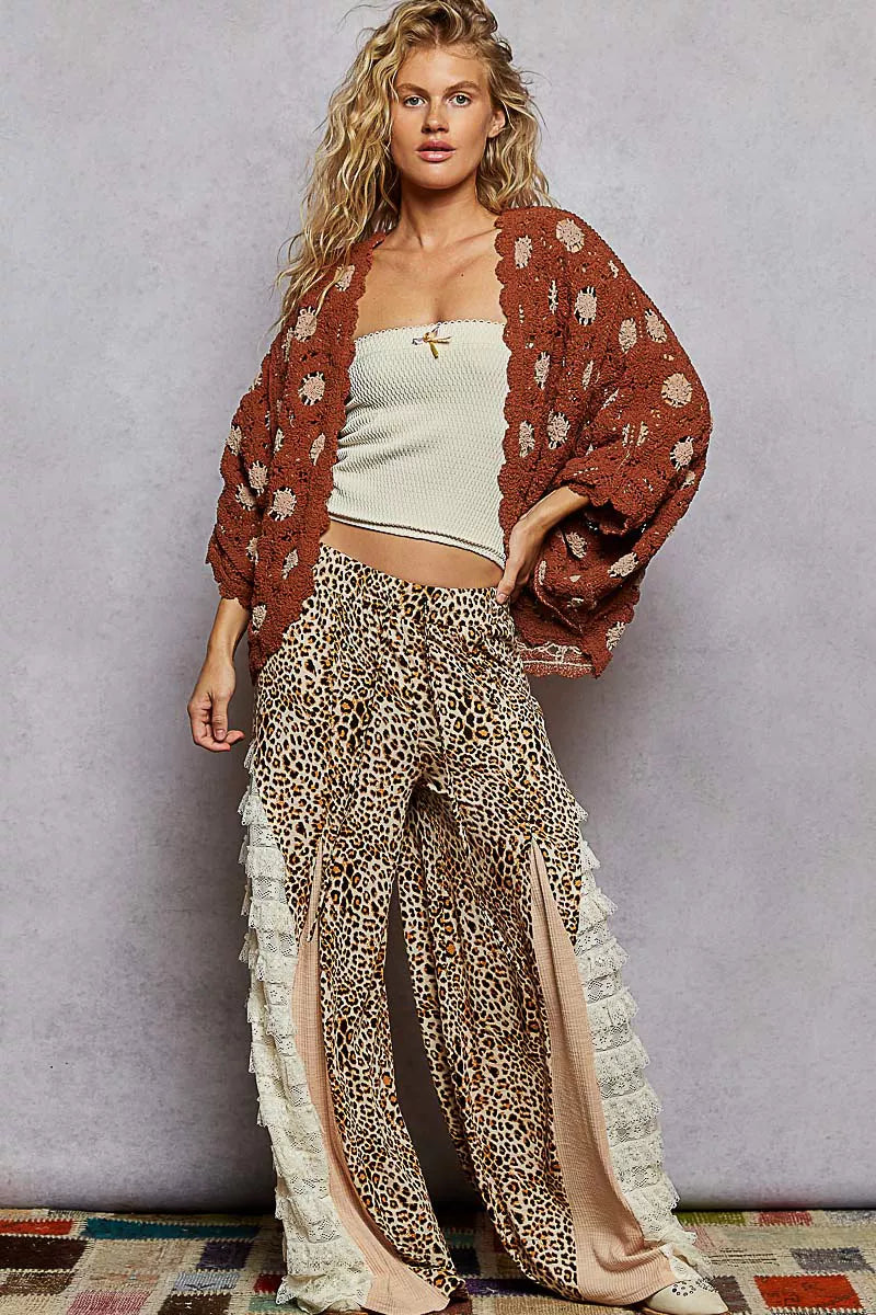 Brick crochet cardigan styled with a crop top and leopard pants for a playful layered outfit