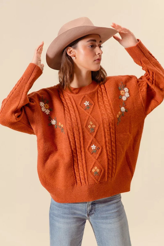 Rust floral embroidered cable knit sweater with diamond stitch detail and relaxed fit for fall boho western style