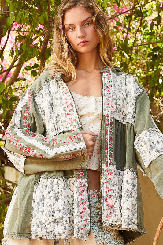 Embroidered denim hoodie in olive green with lace patchwork and floral embroidery, tiered silhouette, boho luxe