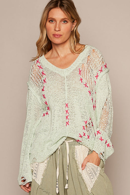 Relaxed Fit Lightweight, Breathable Knit Hot Pink Criss Cross Stitching V Neckline  Long Sleeves Distressed Details For the model’s look, pair with our Seven Seas Harem Pants