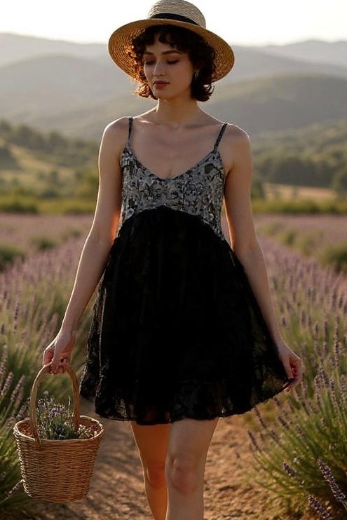 Walking through lavender field in black babydoll mini with grey floral bust, 3D lace skirt, straw hat, and wicker basket in hand—boho femme with a soft romantic twist.