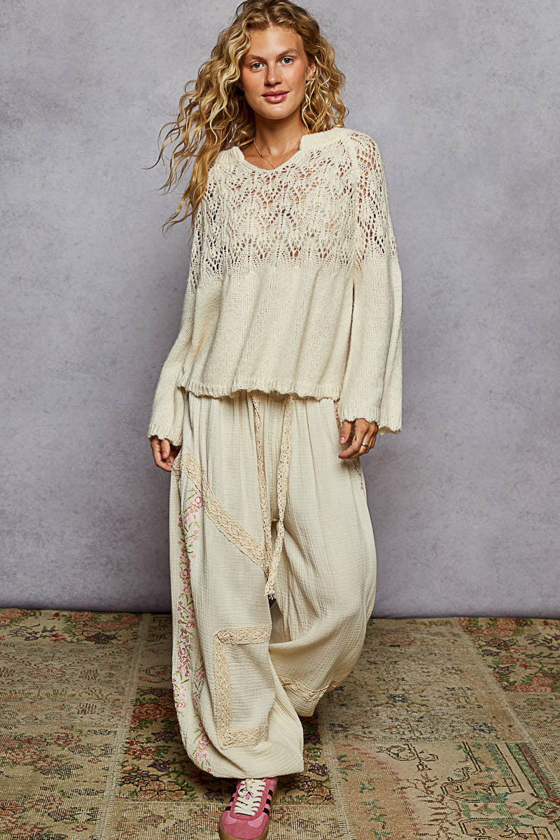 Cream open-weave A-line sweater with airy knit pattern and soft boho luxe vibe for effortless layering
