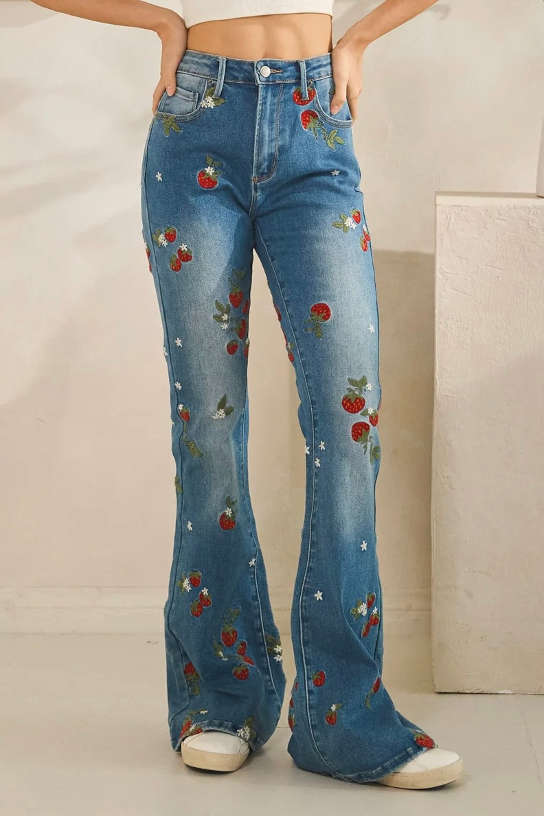 Embroidered flare jeans by Oli & Hali in dark wash stretch denim with strawberry floral details and retro 70s vibe