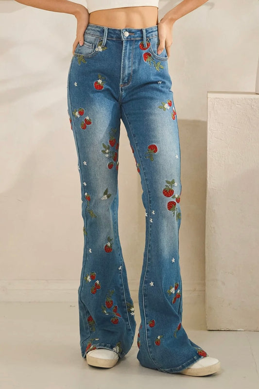 Embroidered flare jeans by Oli & Hali in dark wash stretch denim with strawberry floral details and retro 70s vibe