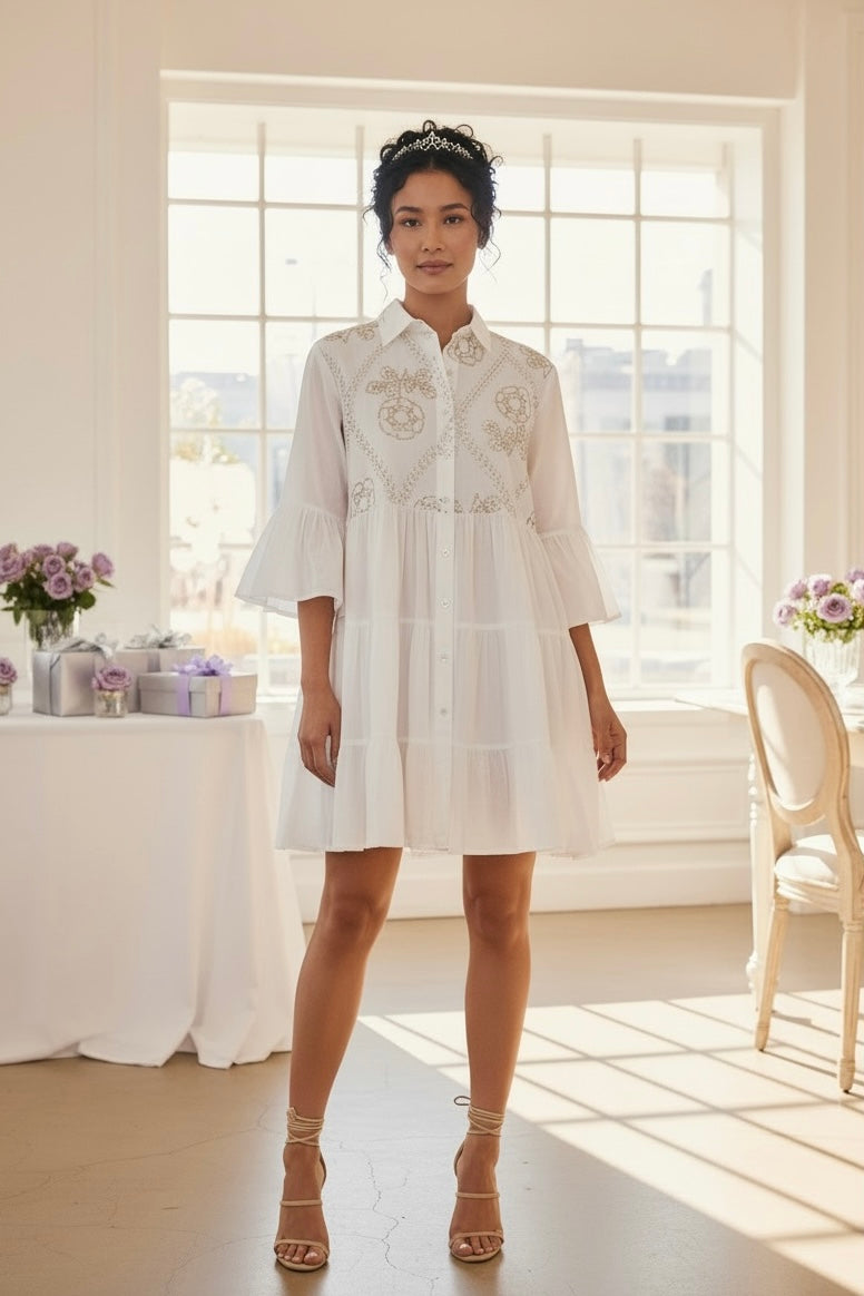 White ivory western mini dress with sequin embroidery, tiered skirt, ruffle sleeves, and tiara at a bridal shower
