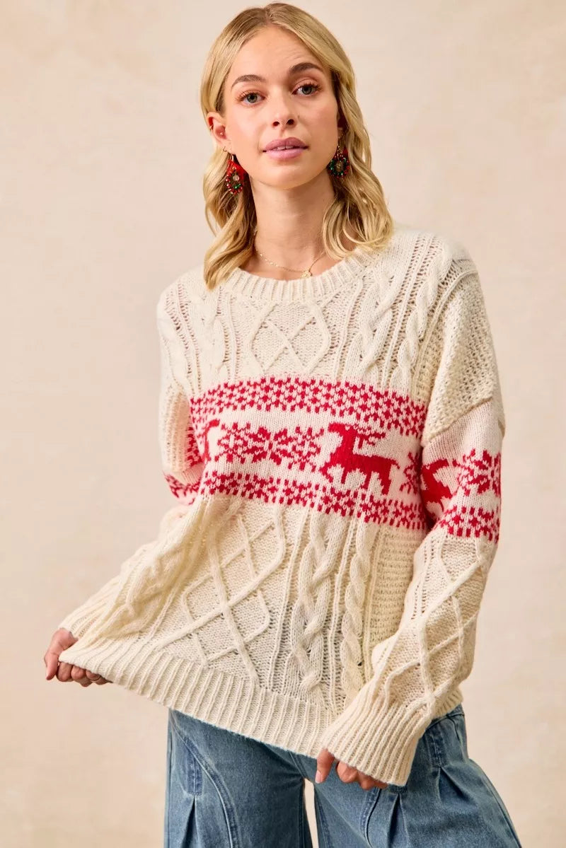 cream cable knit Christmas pullover with red reindeer fair isle pattern, cozy après-ski winter vacation sweater