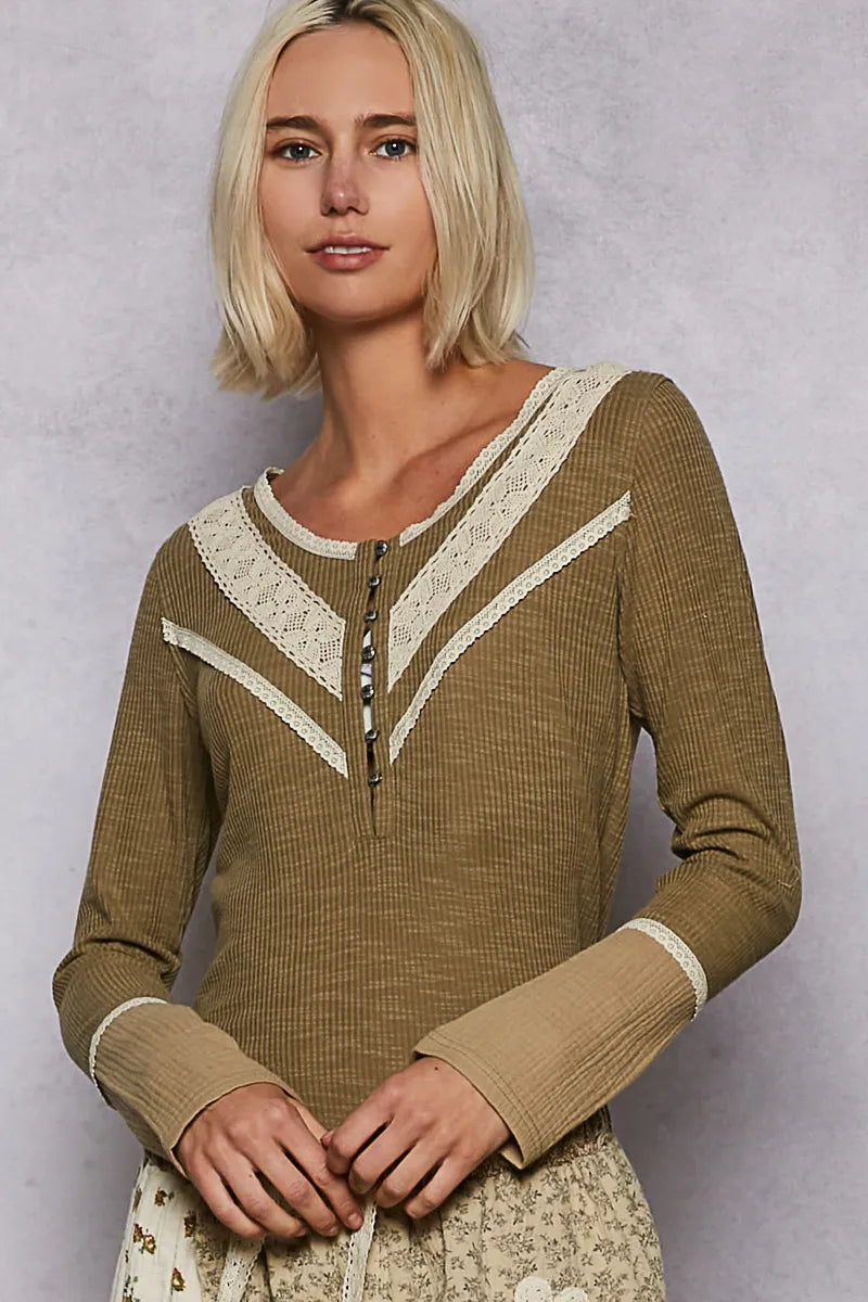 Model wearing a long sleeve olive rib knit Henley top with lace trim & contrast cuffs. Studio studio shot against a clean background