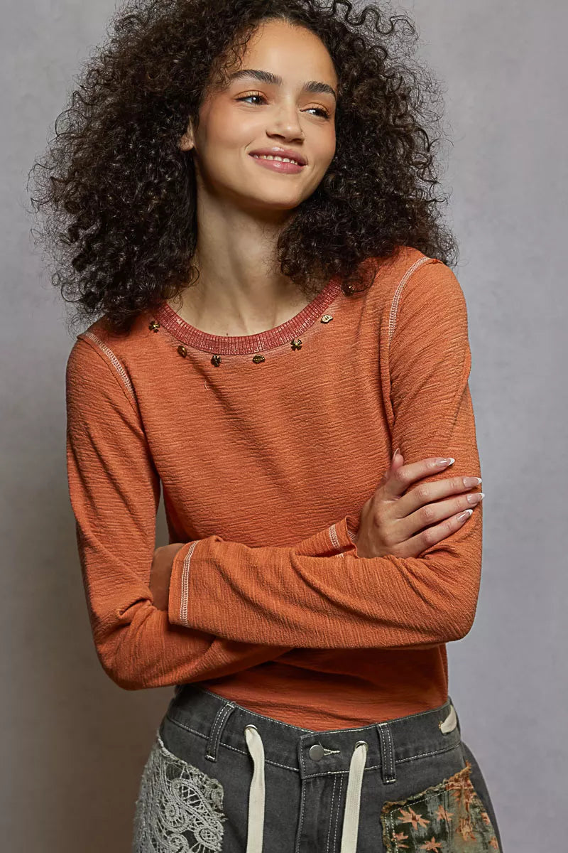 Studded long sleeve, regular fit, knit top in burnt orange with contrast stitching for cozy fall layering