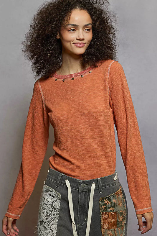 POL pumpkin orange long sleeve top with studded neckline and contrast stitching for everyday casual chic style