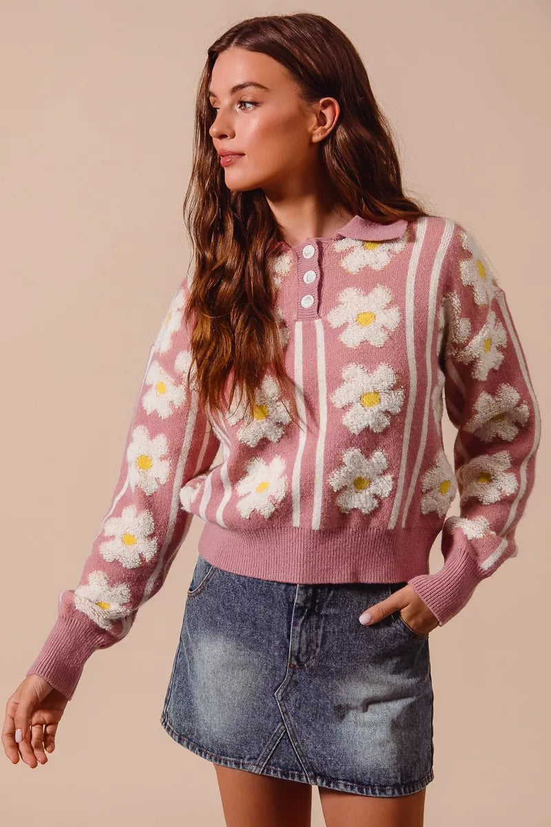 Mauve knit pullover with ivory daisy flowers and button front neckline