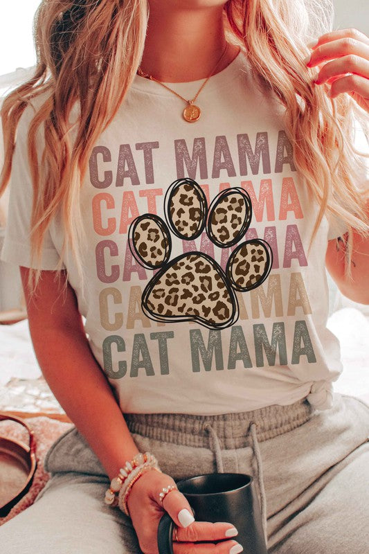 A Unisex Sizing Shoulder Taping Side-Seamed Pre-Shrunk Crew Neck Short Sleeves. Cat Mama written 5 times in a block across the front with a big leopard paw print in the middle