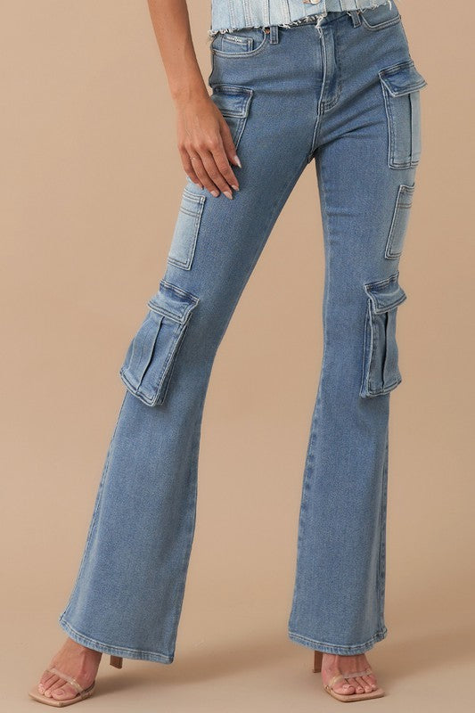 The medium wash jeans have a bootcut silhouette with a regular fit that’s slim through the hip and thighs. They have a 5 pocket style with multiple cargo and Utility pockets down the legs for a total of 12 pockets. The high waist ensures a flattering fit and pairs well with tucked-in tops or cropped styles. They’re perfect for pairing with boots, sneakers, or even heels for different occasions.