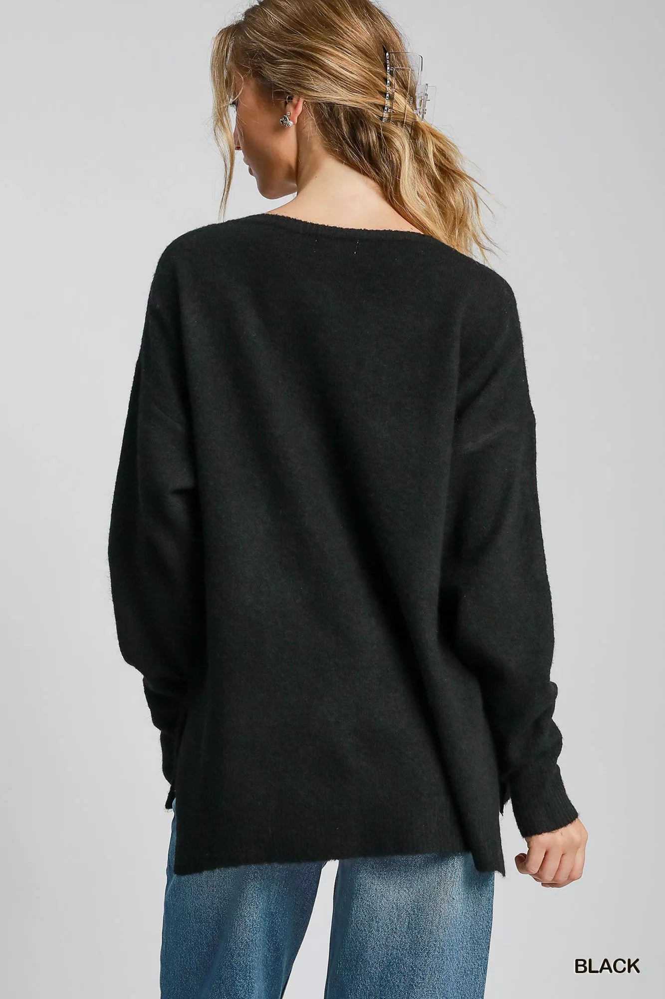 Black V neck wool blend sweater, women’s long sleeve pullover knit with hi-lo hem and side slits, minimalist chic style shown from back