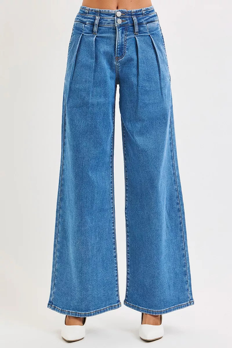 Front view of Risen mid rise wide leg pleated jeans with double button waist