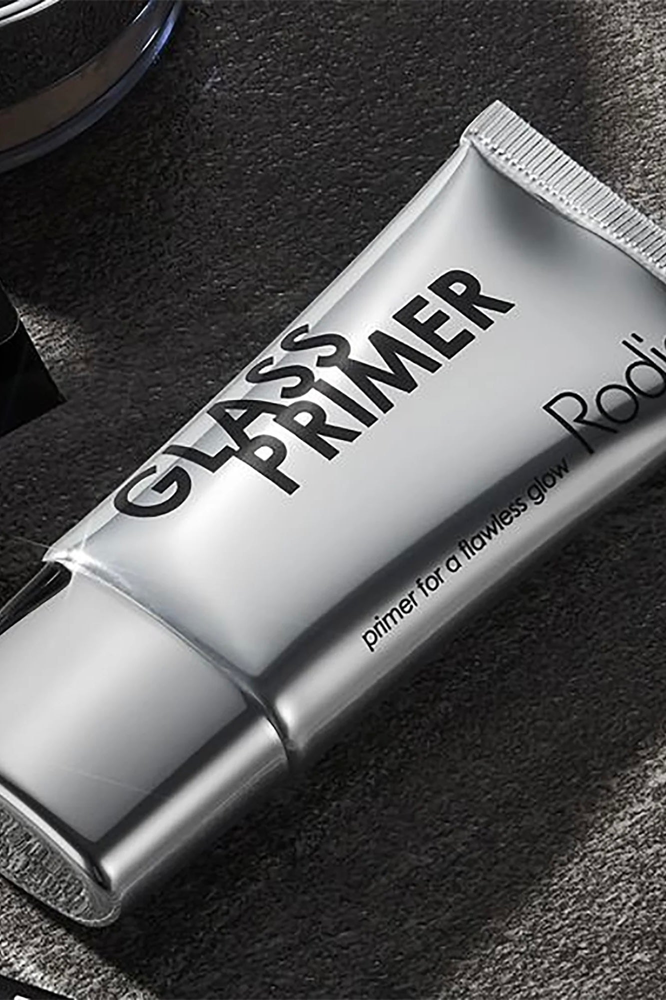 Rodial Glass Primer tube with lightweight hydrating gel formula, dewy makeup primer for a radiant glass-skin finish.