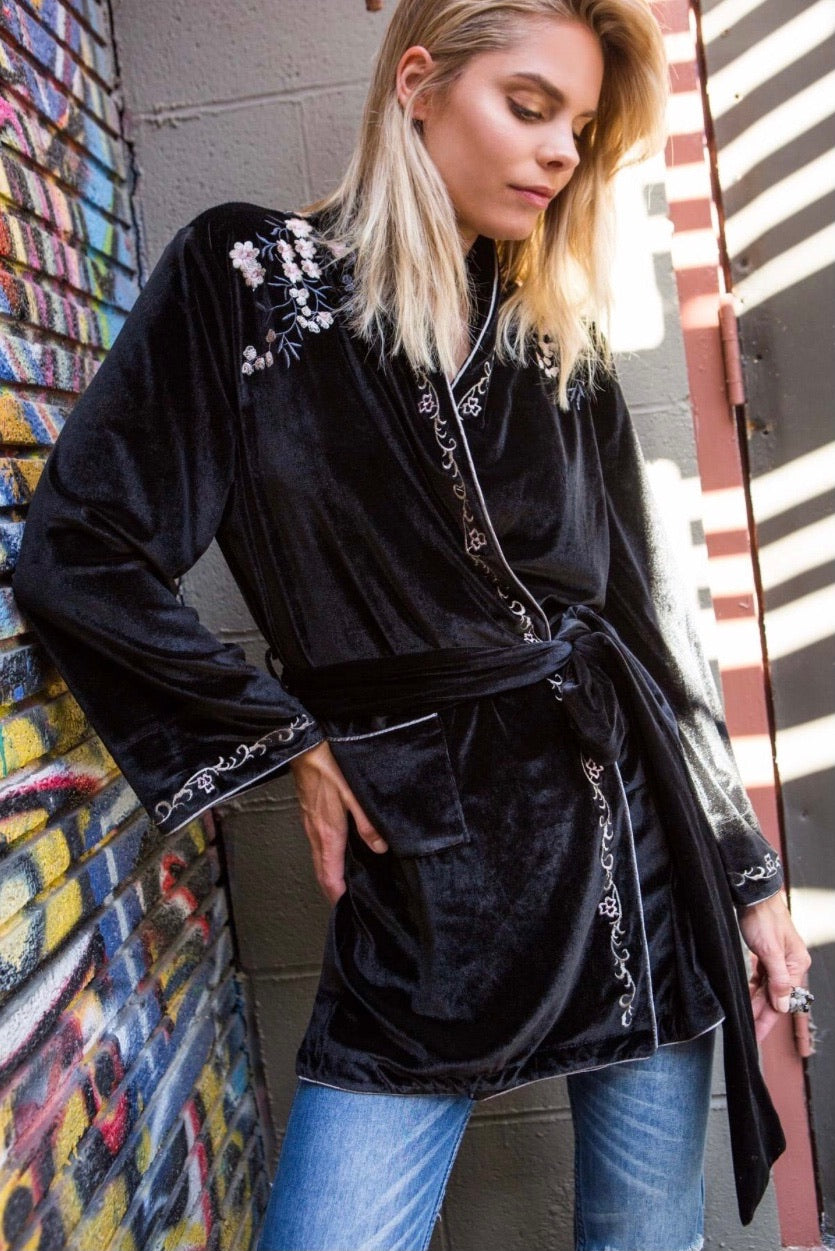 Black velvet floral embroidered cardigan with tie waist and contrast trim styled belted over jeans for a casual luxe look