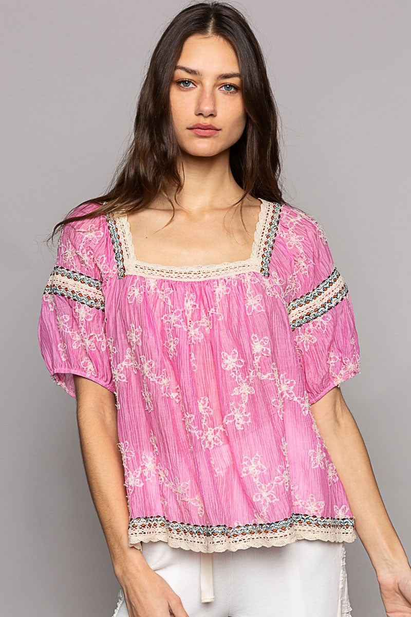 Oversized, Shapeless Fit Semi-Sheer Chiffon Square Neckline Back of the Neck Self Tie Detail  Raglan Half Sleeves with Elastic Cuffs Floral Embroidery Lace Trim Detail For the model’s look, pair with our Mykonos Pants