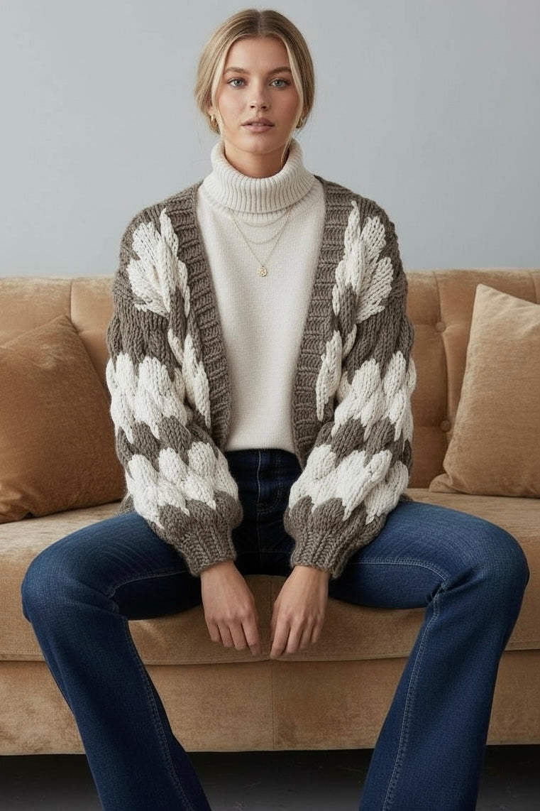 olive and cream handmade chunky knit cardigan with oversized fit and chunky puff stitch sleeves for neutral desert inspired layers