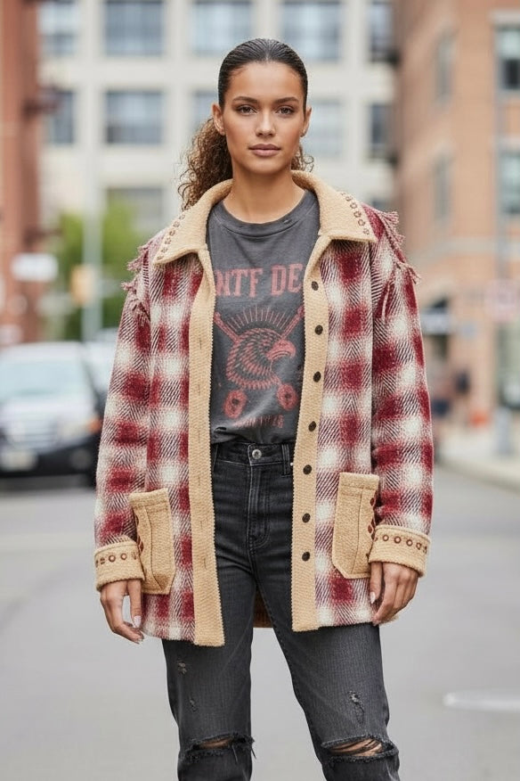 Oversized plaid sherpa trim jacket in an urban street style look with layered tee and casual denim.