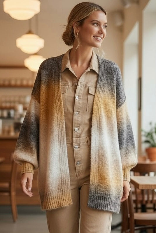 Yellow ombre striped long cardigan worn at a cafe for a casual boho luxe look with an open front and soft knit balloon sleeves.
 