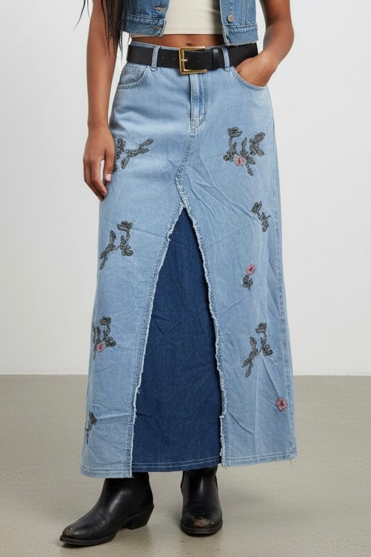 Blue denim maxi skirt featuring floral embroidery, high waist silhouette and bohemian western vibe
