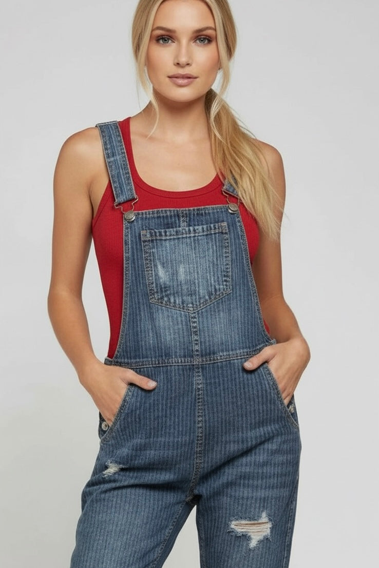 Pinstripe denim overalls with bib pocket, adjustable straps and light distressing in a soft, worn-in cotton denim styled with a red tank