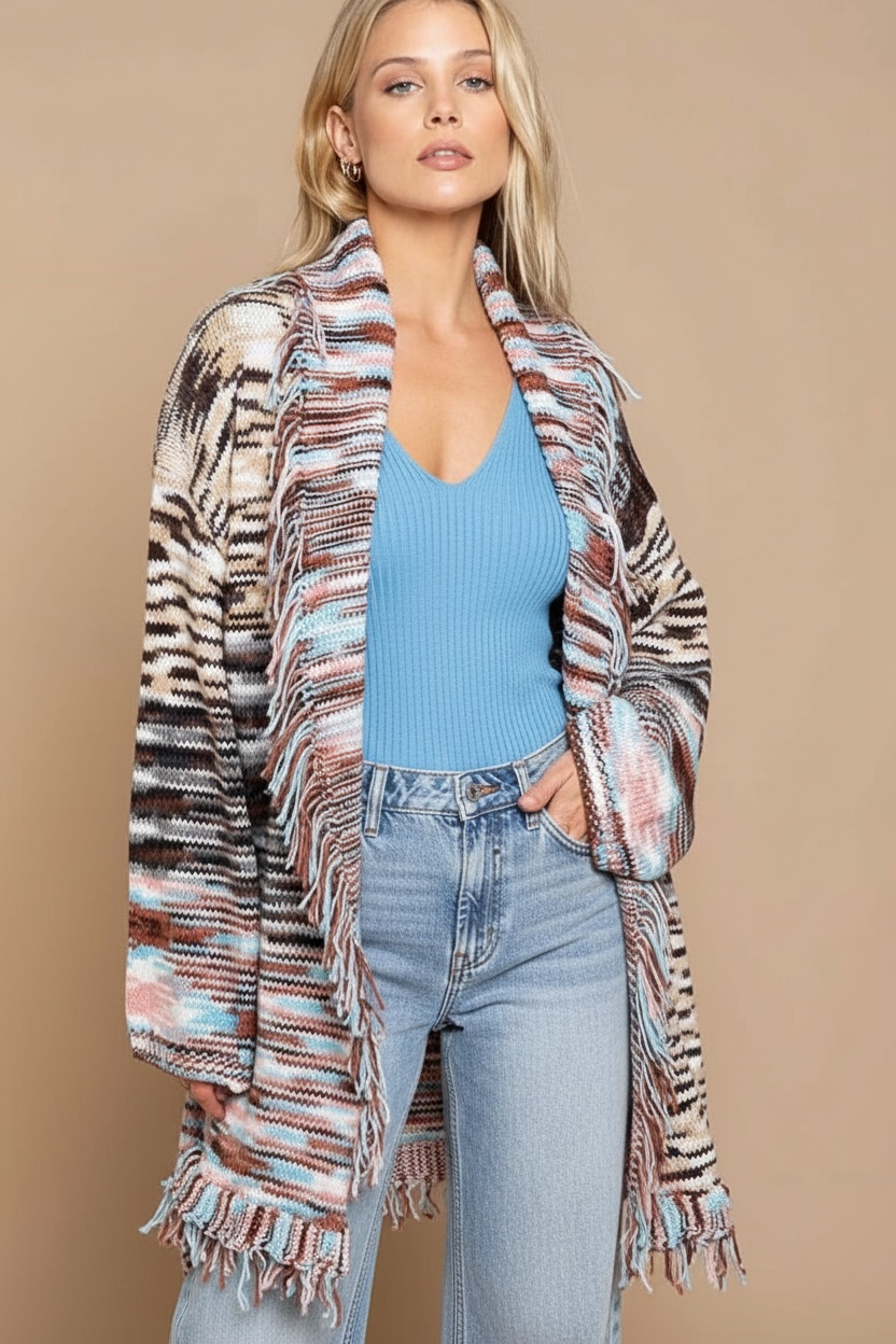 Belted desert fringe cardigan with shawl collar and pockets, styled with jeans and a blue knit top for western boho outfits.