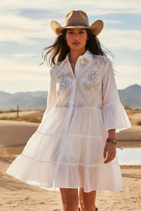 White ivory western mini dress with gold sequin floral embroidery, tiered skirt, ruffle sleeves, and cowboy hat