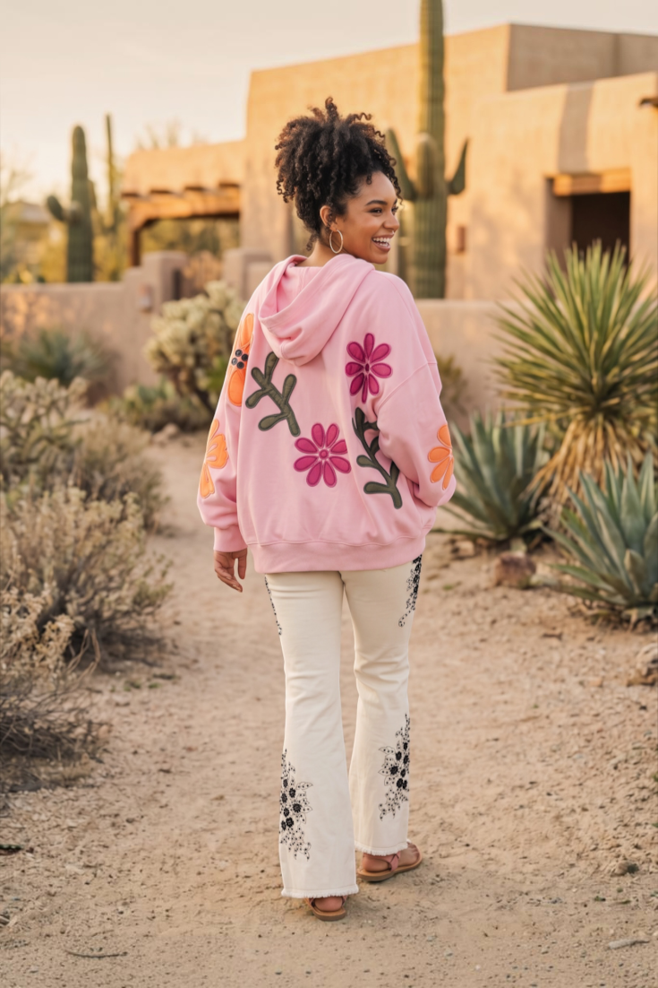 Oversized pink floral patchwork hoodie jacket showing multi texture back graphic artwork
