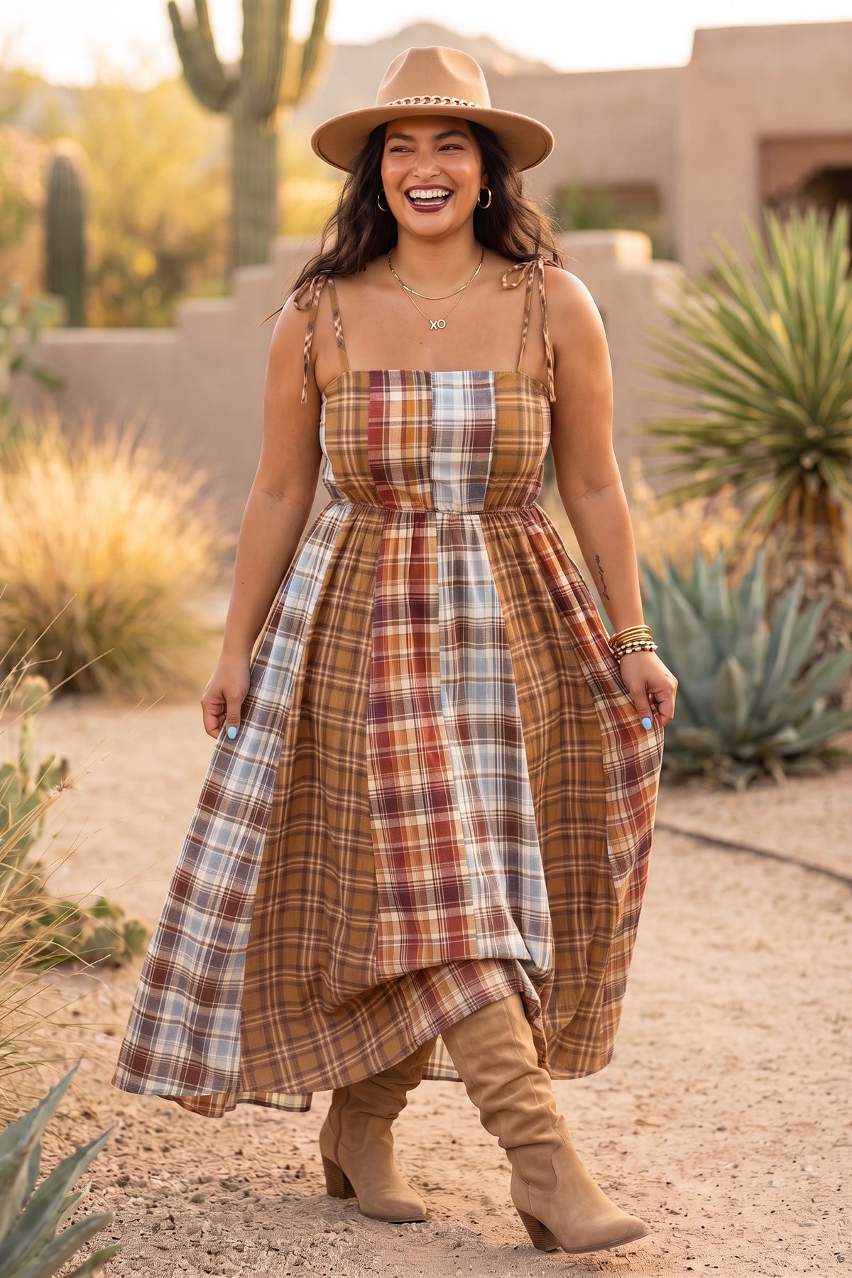 Brown mixed plaid fall maxi dress with tie straps and a skirt held out at the sides while walking