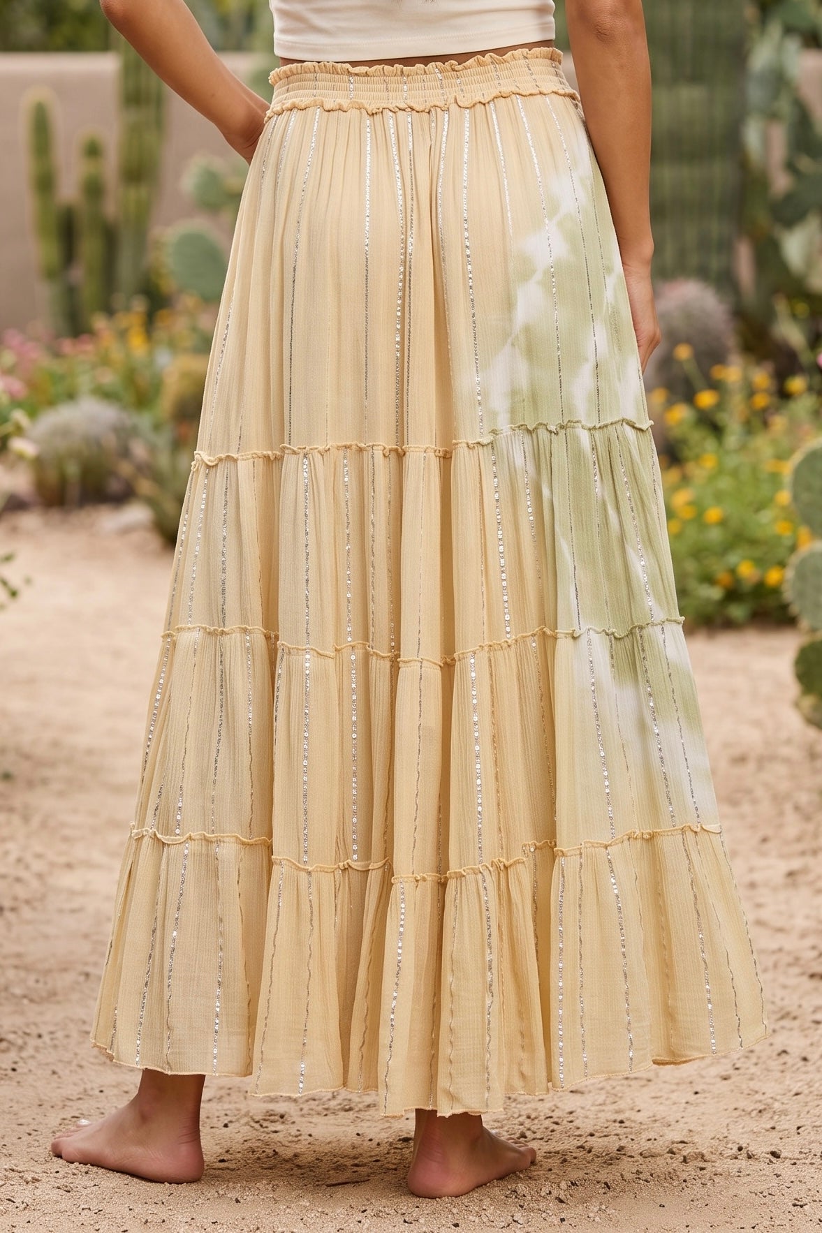 Soft yellow tiered maxi skirt back view with ruffled smocked waist and sage tie dye panel at right