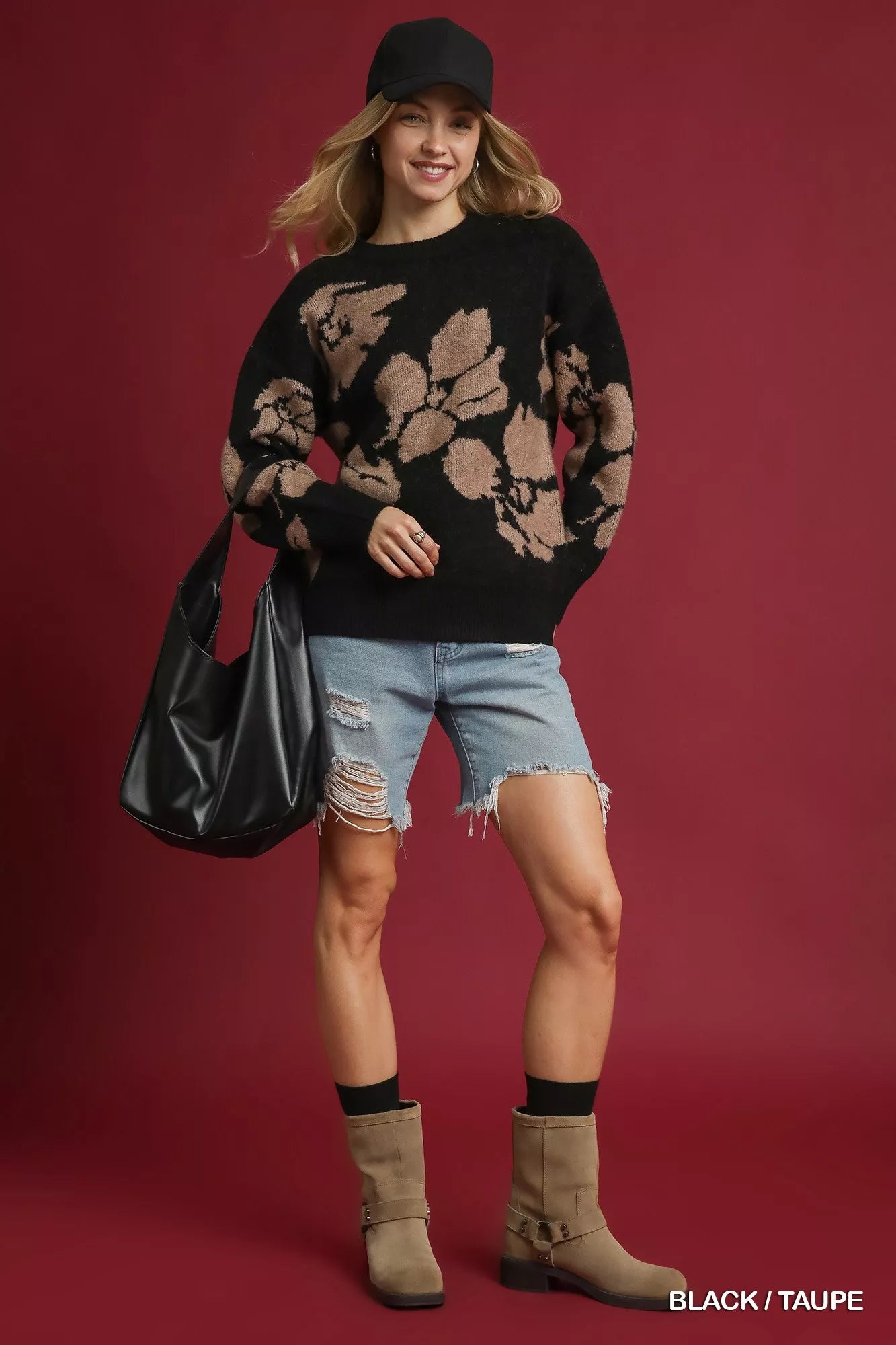 Women’s black floral sweater styled with denim shorts and boots, retro revival knit pullover with feminine fall soft grunge edge