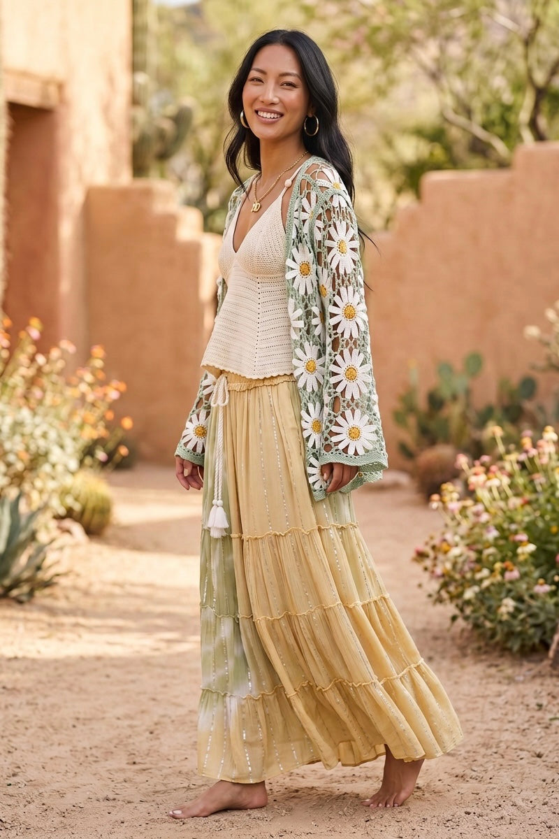 Flowy tiered maxi skirt with long white tassel tie and sage tie dye 3/4 side view worn with mint daisy cardigan